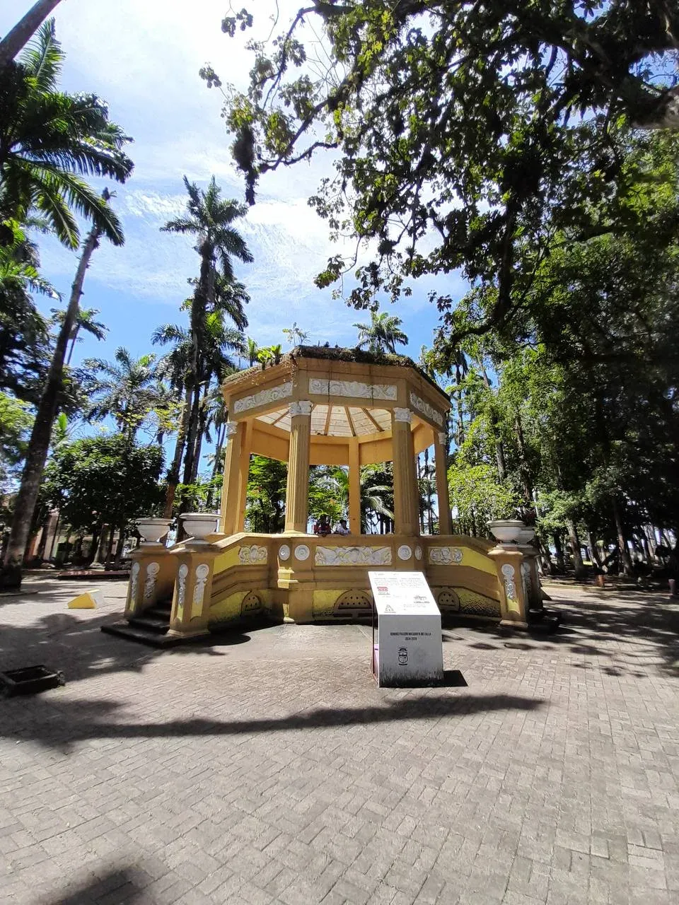 Historic yellow kiosk in a Costa Rican city park